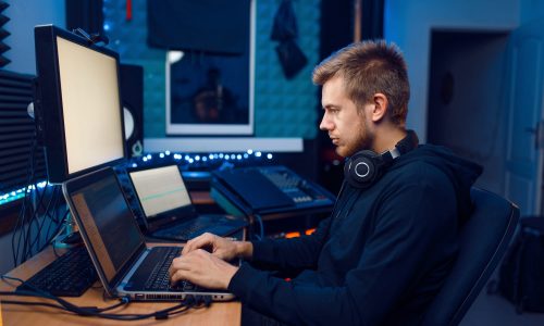 Programmer working on laptop, computer technology